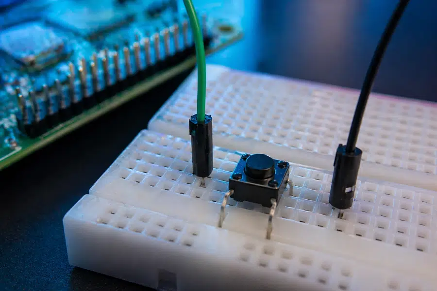 Close-up of push button wiring on breadboard